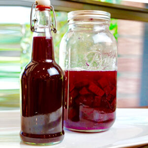 jar and bottle of fermented beet kvass