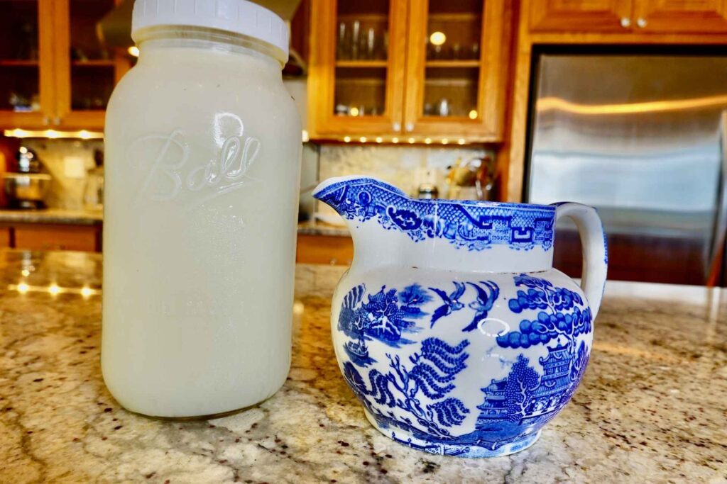 half gallon of raw milk in a ball canning jar